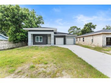 Charming single-Gathering home with a well-maintained lawn and a two-car garage at 5438 Brownell St, Orlando, FL 32810