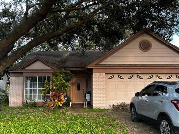 Charming single-story home featuring a two-car garage and well-maintained front yard at 567 Queensbridge Dr, Lake Mary, FL 32746