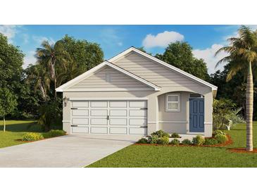Charming single-Gathering home featuring a two-car garage, a blue front door, and lush landscaping at 171 Amberwood Way, Umatilla, FL 32784