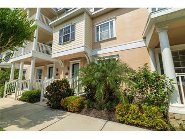 Charming townhome featuring classic architecture, a neatly landscaped yard, and welcoming curb appeal at 415 Old Farm Ln, Winter Springs, FL 32708
