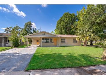 Charming single-story home with a well-maintained lawn and inviting front entrance at 4524 King Cole Blvd, Orlando, FL 32811