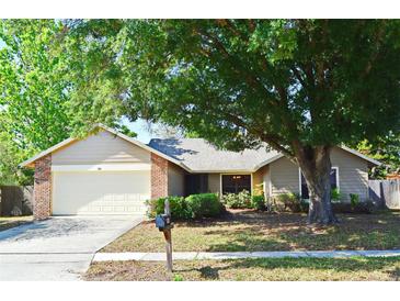 Charming single-story home with brick accents and a well-maintained front yard at 984 Dinero Dr, Winter Springs, FL 32708