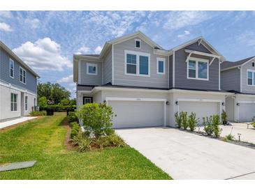 Charming two-story townhouse with a one-car garage and well-maintained landscaping at 1915 Terrapin Rd, Ocoee, FL 34761