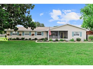Charming single-story home featuring a well-manicured lawn and inviting curb appeal at 701 Lakeshore Blvd, St Cloud, FL 34769