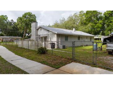 Charming single-story home featuring a fenced yard and a traditional architectural style at 715 Ballard St, Altamonte Springs, FL 32701