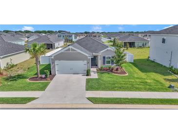 Charming single-story home with a well-manicured lawn, landscaped garden, and inviting curb appeal at 9262 Sw 58Th Cir, Ocala, FL 34476