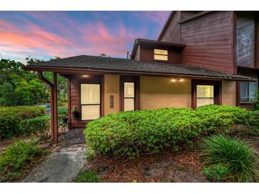 Charming condo showcasing a well-manicured lawn and beautiful earth-tone finishes at 1017 Love Ln # 34, Apopka, FL 32703