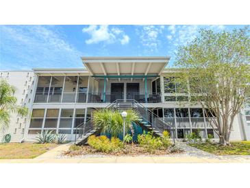 Stylish condo building features a well-maintained facade, inviting entrance, and lush landscaping at 151 N Orlando Ave # 204, Winter Park, FL 32789