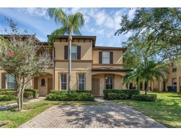 Charming two-story home with a well-manicured lawn and inviting curb appeal at 4143 Calabria Ave, Davenport, FL 33897