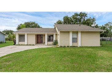 Charming single-story home featuring a well-maintained lawn and welcoming front entrance at 715 Wedge Ln, Poinciana, FL 34759