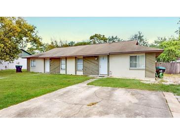 Charming duplex featuring a well-maintained lawn and a private driveway at 12381 Antonio Cir, Orlando, FL 32826