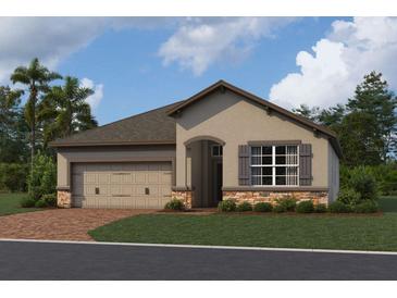 Charming single-story home featuring a two-car garage, and stone accents at 5250 Teirgarten St, St Cloud, FL 34771