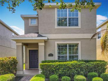 Charming two-story home with well-maintained landscaping and inviting front entrance at 5772 Laurel Cherry Ave, Winter Garden, FL 34787