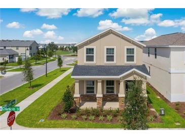 Charming two-story home with manicured lawn and curb appeal at 11807 Charades St, Orlando, FL 32832
