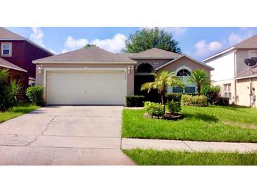 Charming single-story home with a well-maintained lawn and a two-car garage at 6704 Westlake Blvd, Orlando, FL 32810