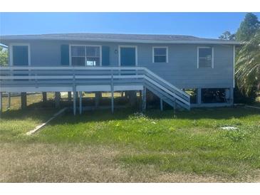 Charming home exterior with raised porch and light blue painted wood at 14330 Ellerbee St, Winter Garden, FL 34787