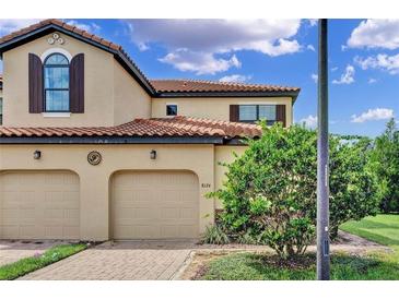 Charming two-story home with a two-car garage and well-maintained landscaping at 8124 Roseville Rd, Davenport, FL 33896