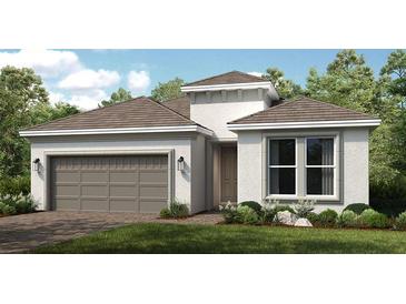 Charming single-story home with a two-car garage and manicured front lawn at 4209 Barbuda Ln, Kissimmee, FL 34758