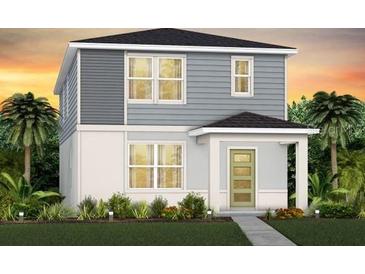 Charming two-story home with a well-manicured lawn and lush tropical landscaping at 7274 Summer Ivy Aly, Orlando, FL 32829