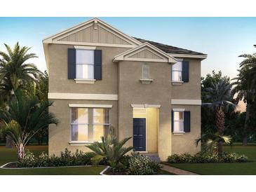 Two-story home featuring neutral paint, a charming entry, and manicured landscaping at 11164 Hollow Bay Dr, Winter Garden, FL 34787