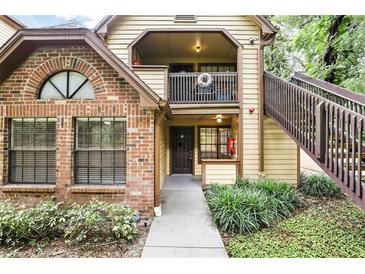 Charming condo with brick accents, balcony, and well-maintained landscaping at 485 Forestway Cir # 108, Altamonte Springs, FL 32701