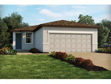 Charming single story home with a manicured lawn, neutral color palette, and a two car garage at 907 Donahue Pass, Lake Hamilton, FL 33851