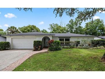 Charming single-story home with well-manicured lawn, inviting entrance, and attached two-car garage at 146 Tollgate Trl, Longwood, FL 32750