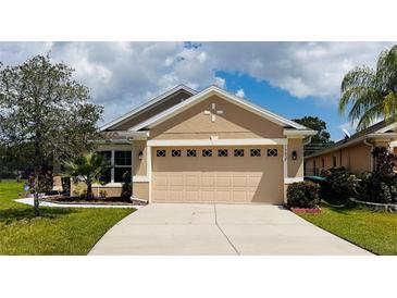 Charming single-story home with a well-manicured lawn and a two-car garage, perfect for comfortable living at 15637 Carina Dr, Orlando, FL 32828