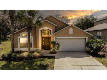 Charming single-Gathering home with a well-manicured lawn and a two-car garage at 2805 Lido Key Ct, Kissimmee, FL 34747