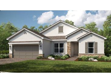 Charming single-story home with stone accents, neutral colors, and a well-manicured lawn, perfect for curb appeal at 5652 Nevis Ter, Kissimmee, FL 34758