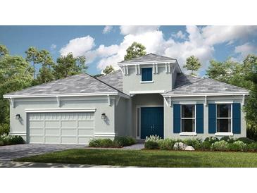 Charming one-story home features a two-car garage, well manicured lawn, blue door, and lovely architectural details at 5658 Nevis Ter, Kissimmee, FL 34758