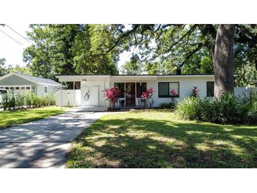 Charming single-story home featuring a well-manicured lawn and an inviting, covered front entrance at 2114 Mount Vernon St, Orlando, FL 32803