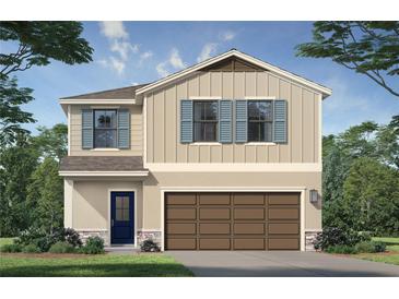 Charming two-story home with a two-car garage, blue shutters, and stone accents at 3255 Cup Dr, Lakeland, FL 33803
