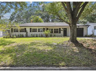 Charming single-story home with a well-maintained lawn and mature trees in a desirable neighborhood at 3520 N Westmoreland Dr, Orlando, FL 32804