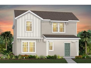 Charming two-story home with a welcoming porch and well-manicured landscaping at 5033 Starling Bird Ln, St Cloud, FL 34771