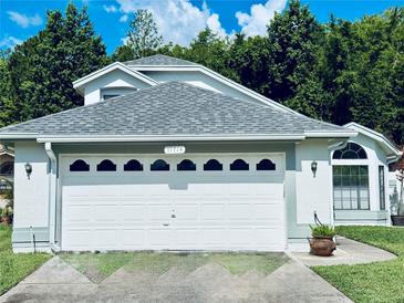 A well maintained single Gathering house with a two car garage and nice landscaping at 11714 Peachstone Ln, Orlando, FL 32821