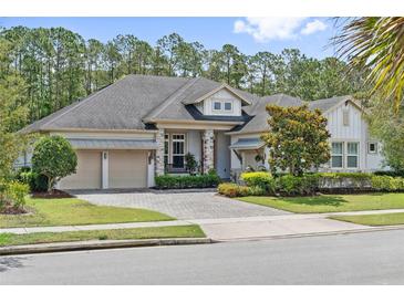 Charming home with a manicured lawn, beautiful landscaping, and a three-car garage at 13137 Lower Harden Ave, Orlando, FL 32827