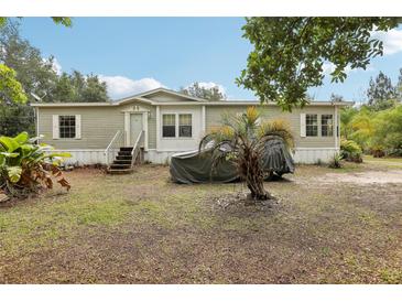 Charming single-story home with a well-maintained front yard and mature trees offering shade at 2229 N 6Th St, Orlando, FL 32820
