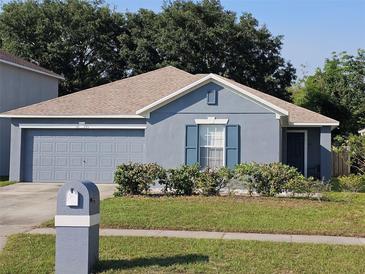 Charming one-story home with gray paint, well-kept lawn, and a cozy, inviting appeal at 3055 Leflore Ln, Orlando, FL 32833