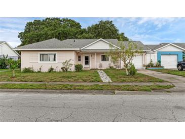 Charming single-story home featuring a manicured lawn and a welcoming entryway at 3162 Little Sound Dr, Orlando, FL 32827