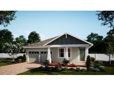 Charming one-story home with a welcoming porch, attached two-car garage, and beautifully landscaped front yard at 322 Ridgemark Ave, Groveland, FL 34736