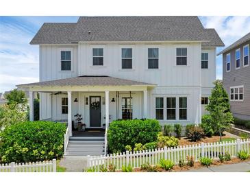 Charming two-story home with a welcoming front porch and beautifully landscaped yard at 1071 Kershaw Dr, Winter Garden, FL 34787