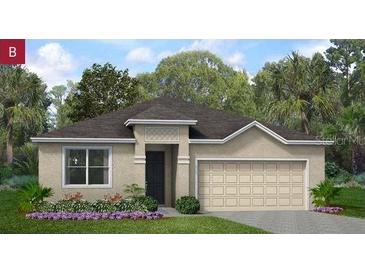 Charming single-story home with a neutral stucco exterior, an attached two-car garage, and verdant landscaping at 499 Silver Palm Dr, Haines City, FL 33844
