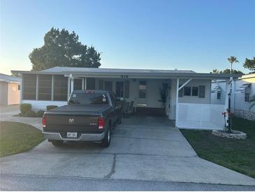 Charming single-story home with covered parking and decorative landscaping at 816 Polo Park East Blvd, Davenport, FL 33897