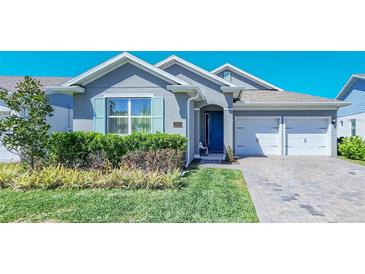 Charming single-Gathering home with a well-manicured lawn and a two-car garage at 18851 Rawson St, Orlando, FL 32827