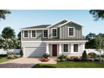 Charming two-story home features a manicured lawn, attached garage, and inviting front porch at 4624 Laurel Site Loop, Apopka, FL 32712