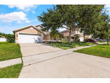 Charming single-Gathering home with a two-car garage and mature landscaping, ready for new homeowners at 3078 Mandolin Dr, Kissimmee, FL 34744