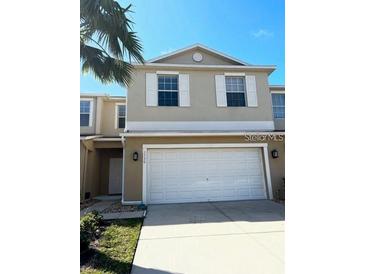 Charming townhouse with two-car garage and neutral color palette at 3530 Rodrick Cir, Orlando, FL 32824