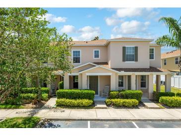 Charming townhome featuring well-manicured landscaping and a welcoming front porch at 3112 Seaview Castle Dr, Kissimmee, FL 34746