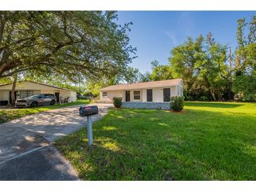 Charming single-story home featuring a well-maintained lawn and inviting curb appeal at 4226 Kelly Miller Ct, Orlando, FL 32811